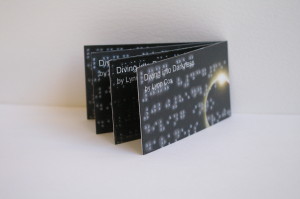 four card display of Brailled business cards